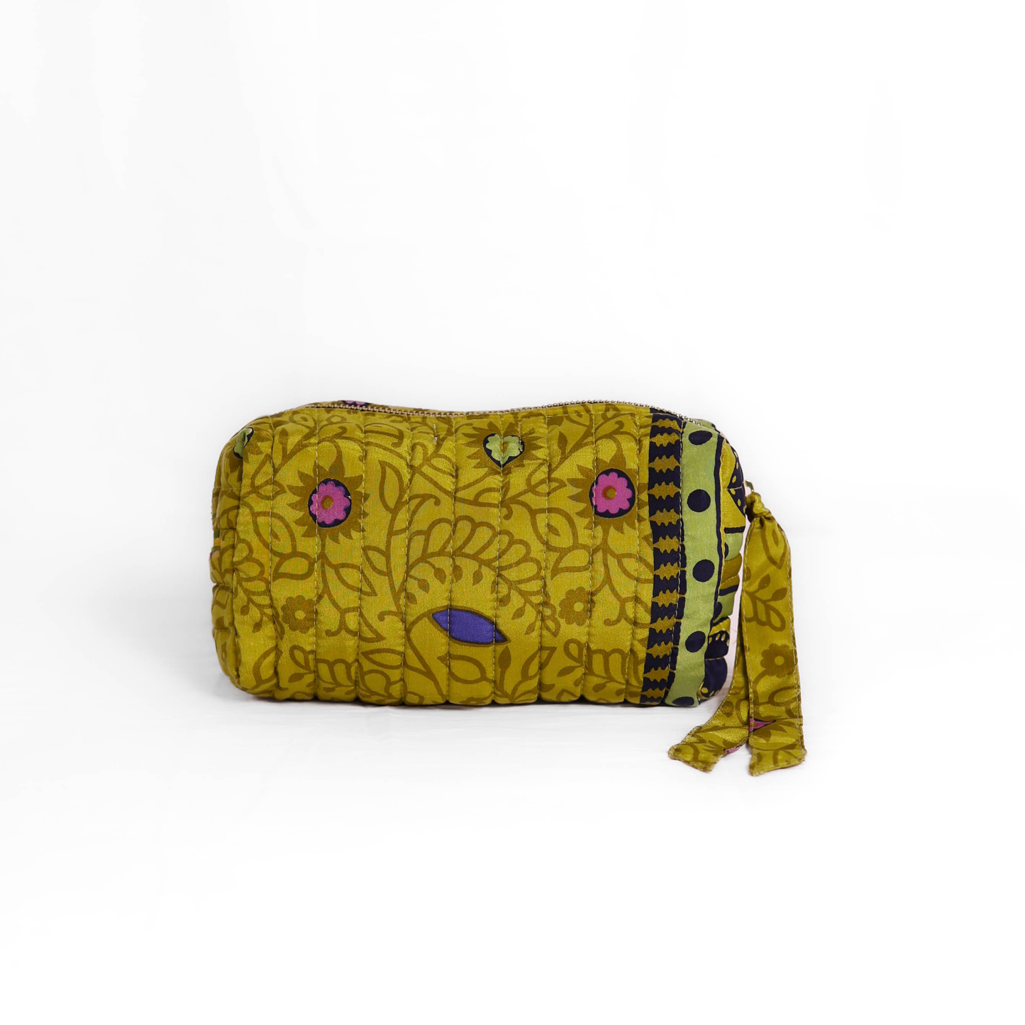 Quilted dumpling bag made from repurposed vintage sari fabric with stitched detailing and a structured rectangular shape. The bag features a zip closure and a fabric tie
