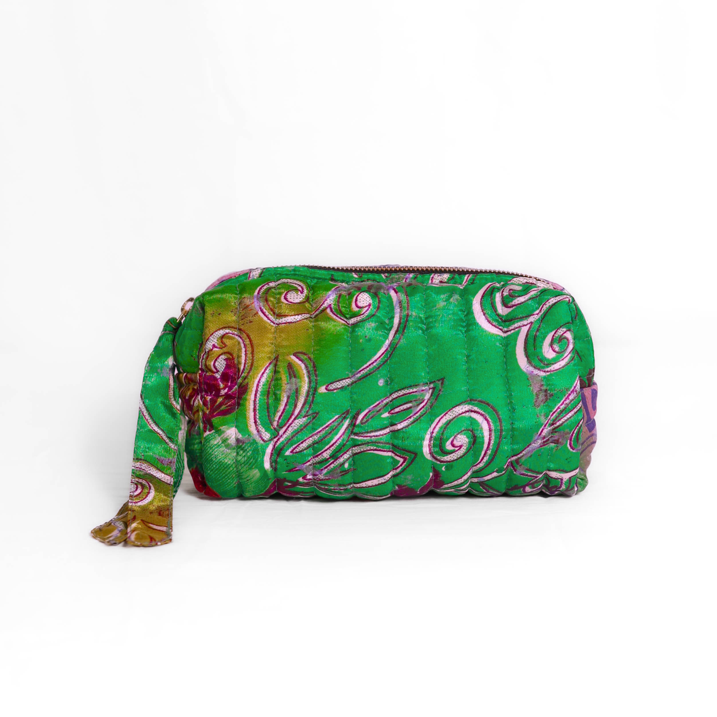 Quilted dumpling bag made from repurposed vintage sari fabric with stitched detailing and a structured rectangular shape. The bag features a zip closure and a fabric tie