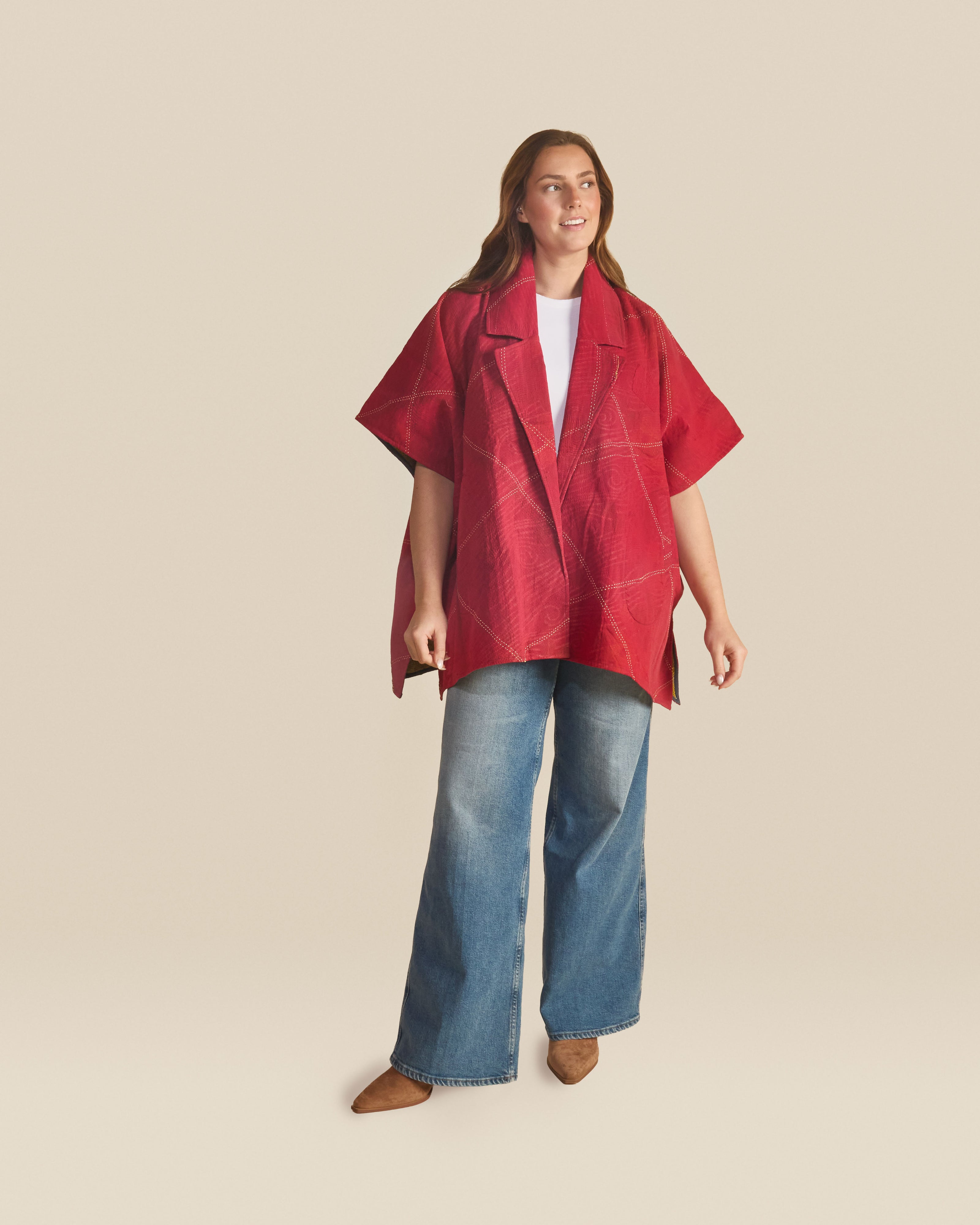Lightweight, airy open-front jacket with a relaxed, flowy silhouette and short wide sleeves. Designed in a vibrant red tone with subtle stitched pattern detailing, it offers an easy, breathable feel.